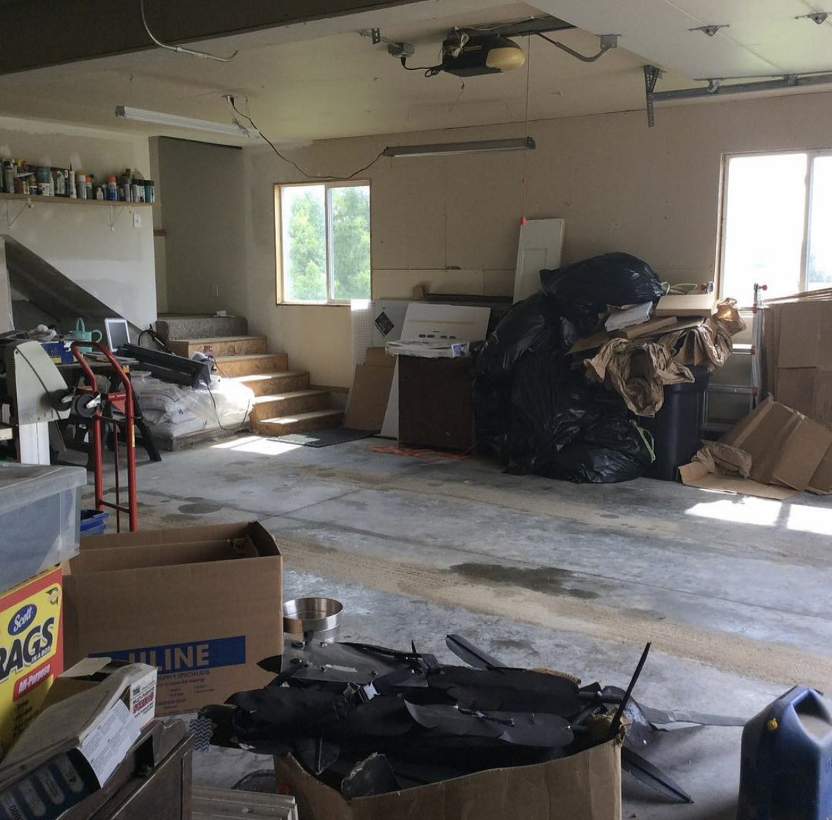 The garage before renovation — five years of accumulated clutter.